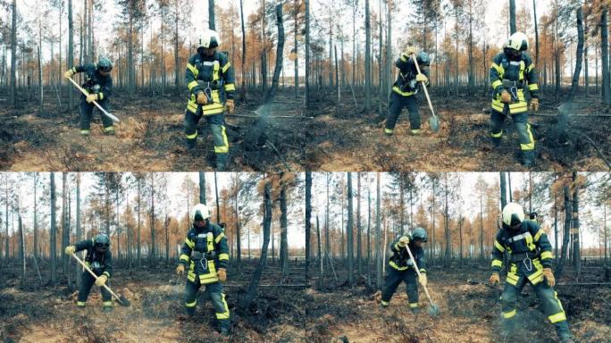 消防员正在抑制闷烧的林地