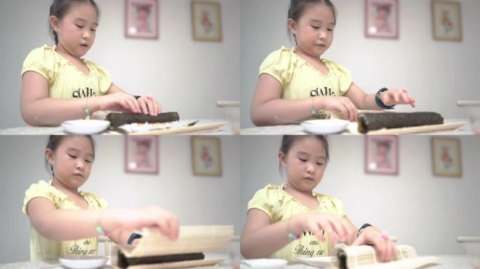 亚洲小女孩在家做寿司