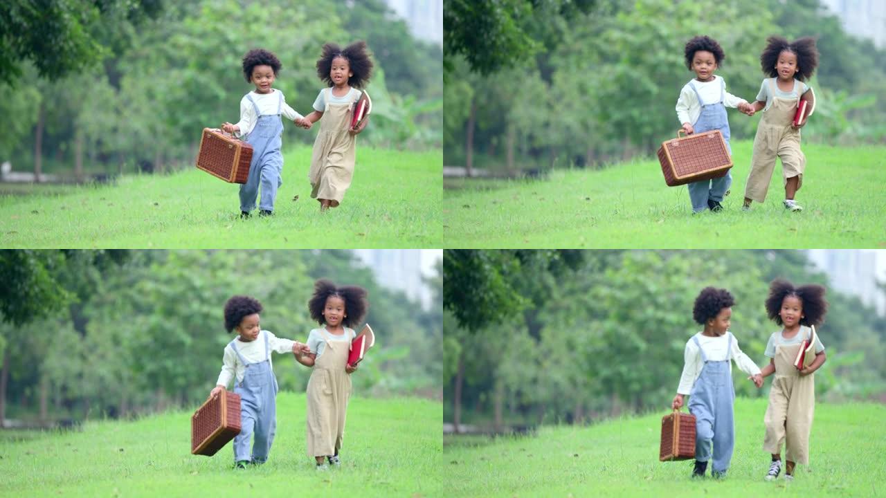 一个大约5-6岁的黑人男孩和女孩正在公园里手工散步。他们两个用可爱的脸看着对方。