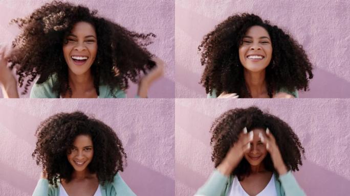 黑人妇女的肖像在粉红色的墙壁上拥抱她的卷发，在户外触摸她的非洲。快乐，拉丁裔和愚蠢的女孩拥抱她的自然