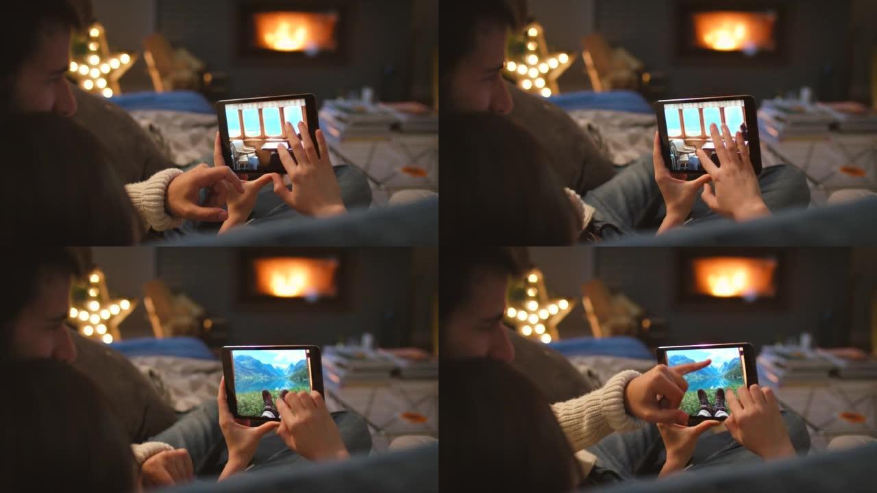 一对夫妇在使用数字平板电脑时在沙发上依sn的4k视频片段