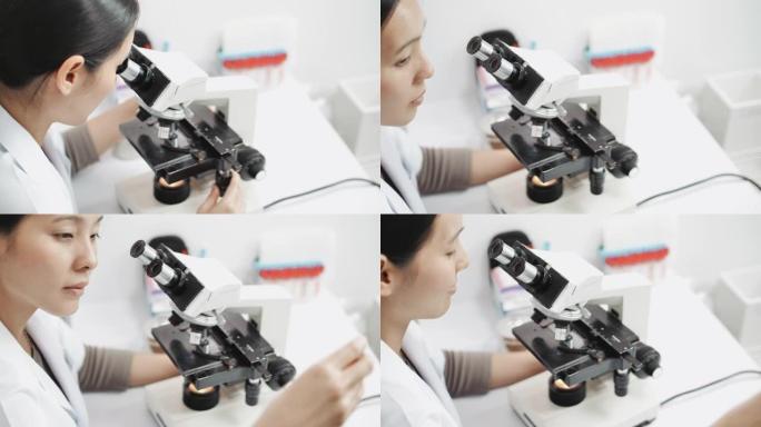 科学家在光学显微镜上进行研究