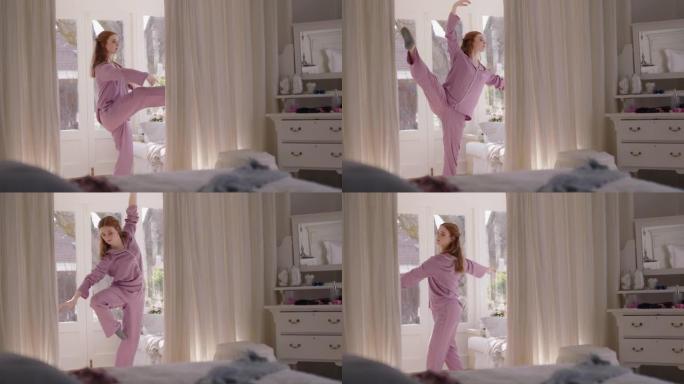 美丽的年轻女子在卧室里练习芭蕾舞周末早上穿着睡衣排练舞蹈