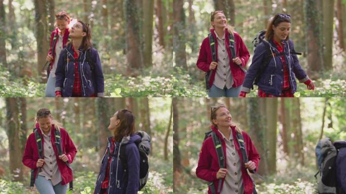 两个女性朋友在假期中徒步穿越树林，享受大自然的乐趣-慢动作拍摄
