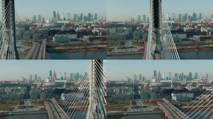 无人机在维斯拉河上空由现代电缆桥留下，揭示了波兰华沙美丽阳光明媚的城市天际线。