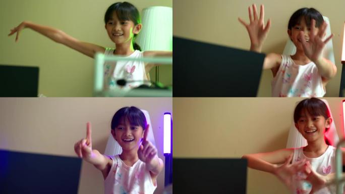 特写女孩通过笔记本电脑上的视频通话与追随者跳舞