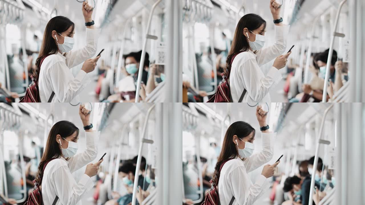 戴着口罩的年轻女子在火车上使用手机进行社交网络，慢动作