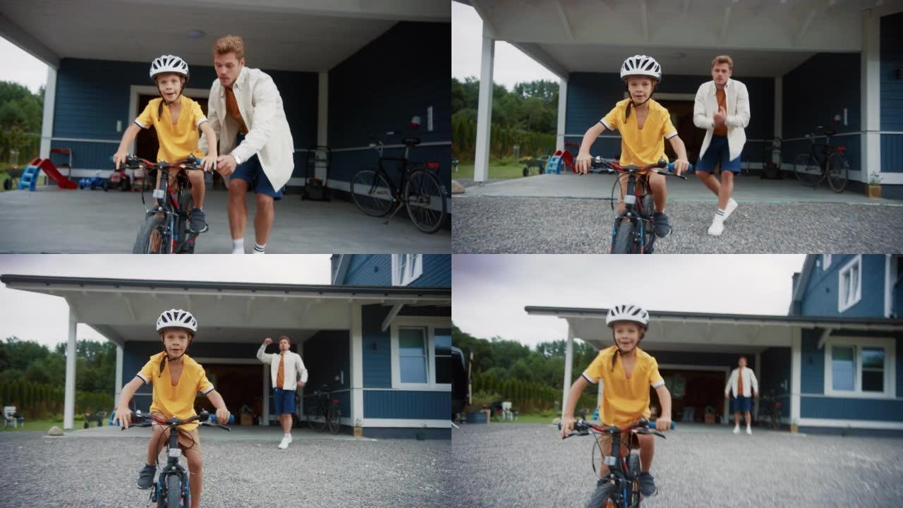 开朗的父亲在教儿子在他们美丽的住宅区的前院骑自行车。男孩戴着头盔，勇敢地骑着自行车平衡自己。手持镜头