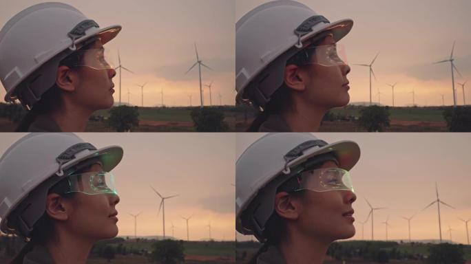 在风力涡轮机农场中戴着虚拟现实眼镜的工程师