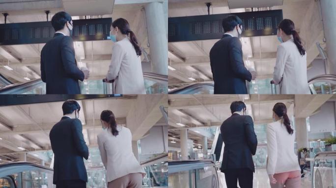 机场的亚洲商人和女商人