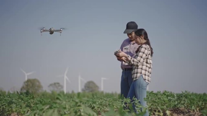 现代农民使用先进技术用无人机监视他的蔬菜作物