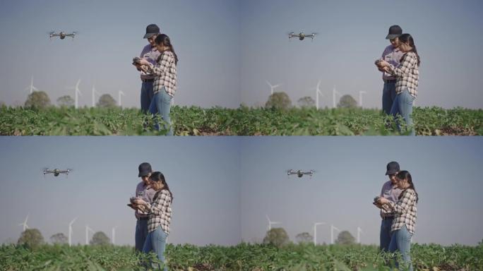 现代农民使用先进技术用无人机监视他的蔬菜作物
