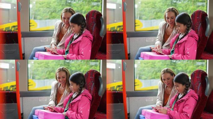上学母亲送女儿上学搭乘公交一对母女
