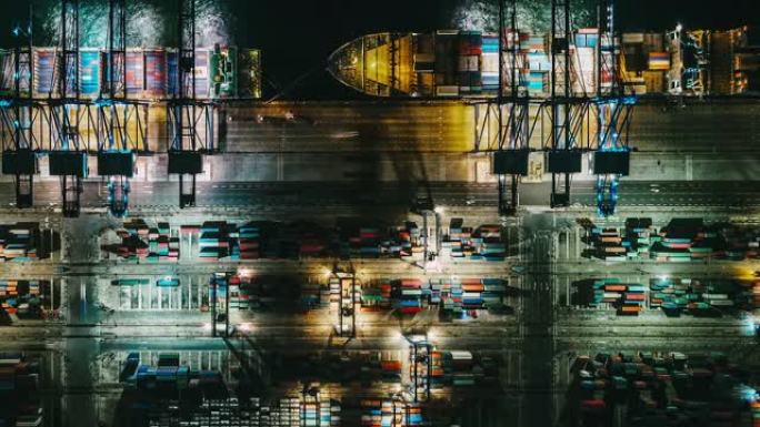 夜间集装箱运输繁忙工业港口的T/L PAN鸟瞰图