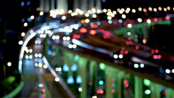 夜间立交桥和城市交通的散焦视图
