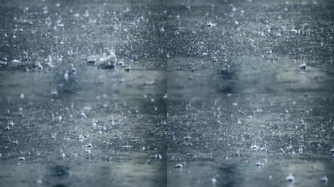 慢动作中的雨滴地面上的雨滴下雨