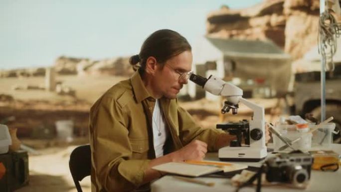 考古挖掘地点: 从事土著文化研究的男性考古学家，在挖掘地点发现古代文明历史文物，化石遗迹，并在显微镜