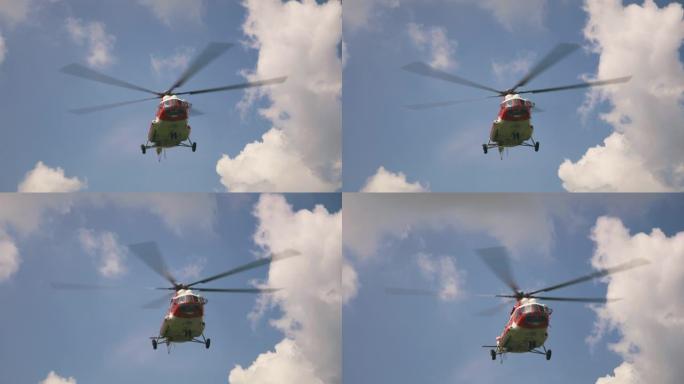 紧急服务直升机在云层上飞行