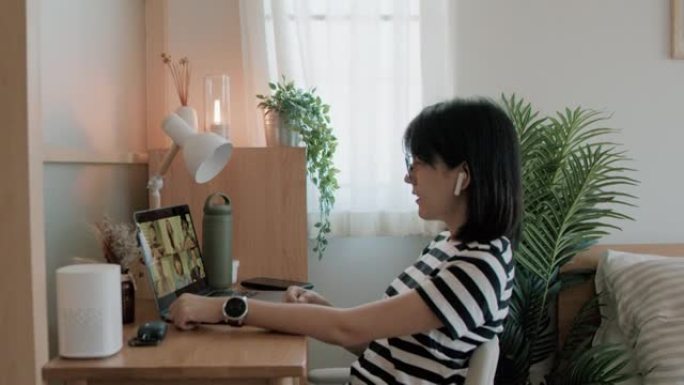 亚洲妇女在家工作群体视频电脑通话居家办公