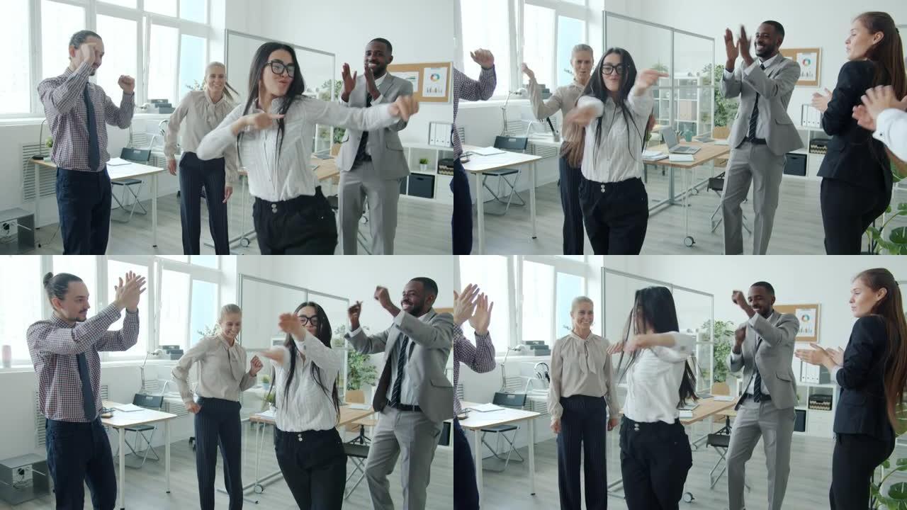 可爱的亚洲女孩在公司活动中与同事一起跳舞的慢动作