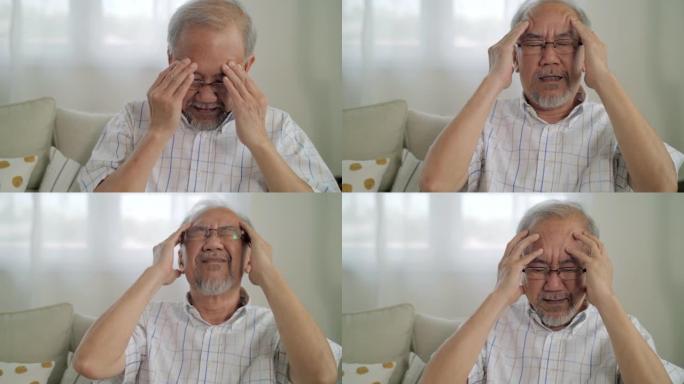 资深男子感到压力和头痛