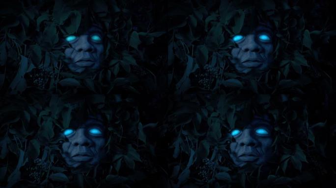 在黑暗中的丛林偶像上发光的蓝眼睛