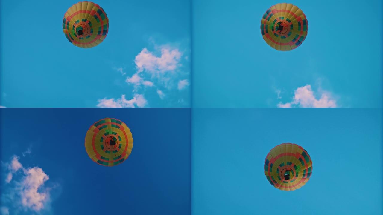 黄色的热气球漂浮在蓝天中