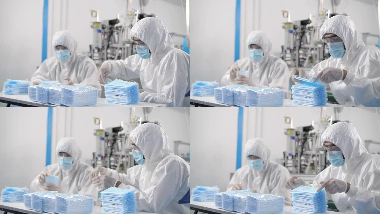 医用口罩生产工人正在组织口罩为冠状病毒疫情做准备