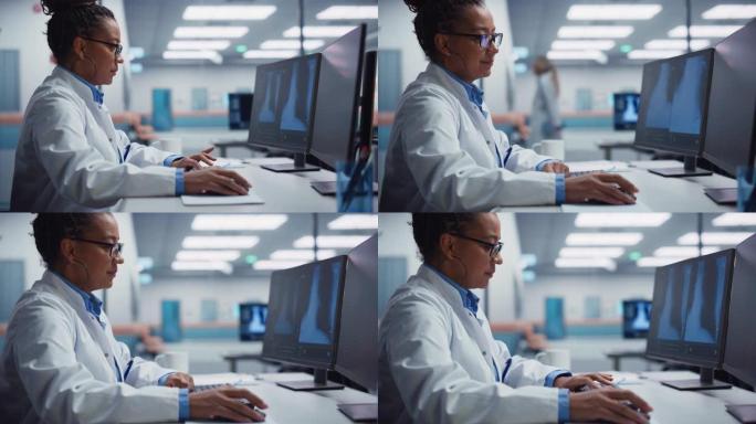 医院实验室: 黑人女医生正在计算机上分析胸部，骨骼的x射线在屏幕上。非裔美国医生做病毒预防治疗研究。