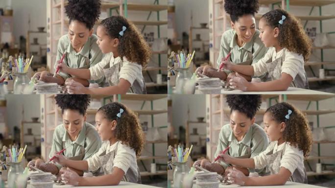 母亲，工作室和女孩一起绘画，帮助或美术课，一起学习，雕塑或培训。亚特兰大的黑人妇女，儿童和艺术，手工