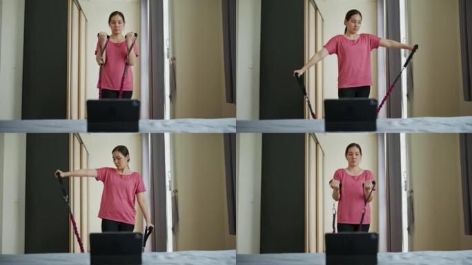 女人在家做虚拟锻炼课