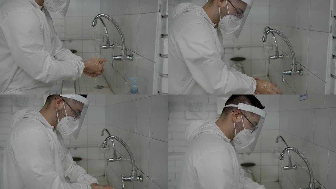 穿着生物安全服，面罩和面罩的年轻人根据新型冠状病毒肺炎指南用肥皂和水洗手