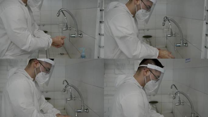 穿着生物安全服，面罩和面罩的年轻人根据新型冠状病毒肺炎指南用肥皂和水洗手