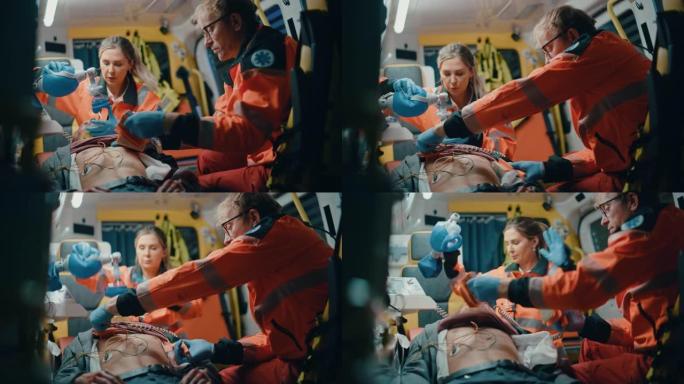 紧急医疗护理队在送往医院的途中为受伤的病人提供医疗帮助。紧急护理助手使用除颤器和通气面罩在救护车上使