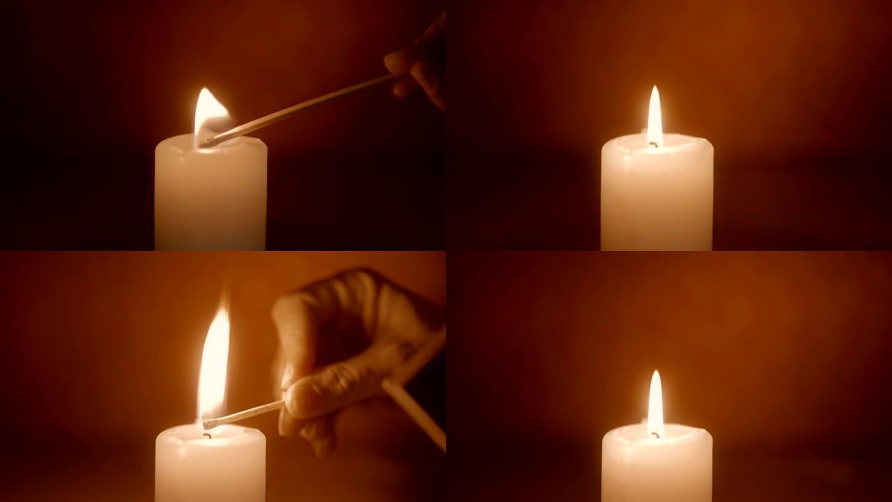 用火柴棍点燃蜡烛点亮烛火光亮