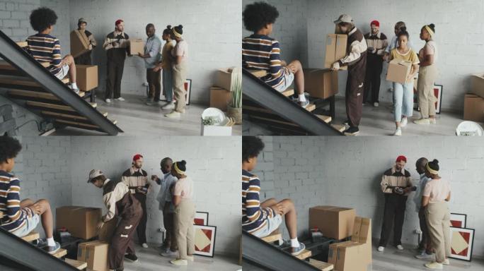 非裔美国人家庭的Slowmo从搬运工那里接收箱子