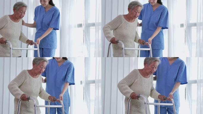 亚洲女性照顾者帮助亚洲老年妇女在家中或医院进行步行训练和康复过程。老年祖母听照顾者提供支持，老年人保