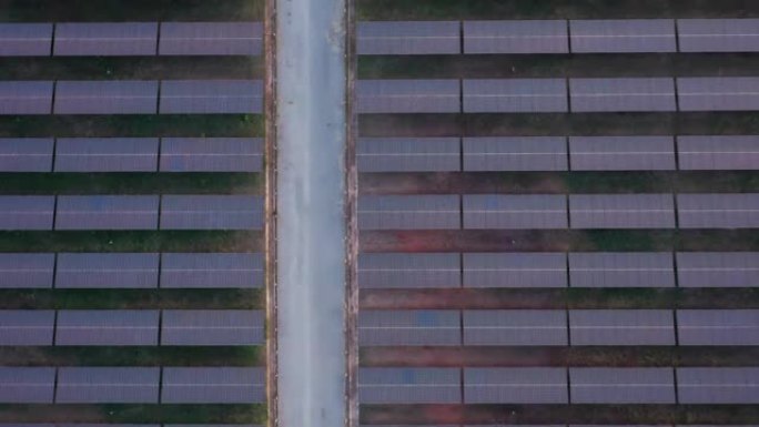 光伏太阳能电池板的鸟瞰图，可再生能源，清洁可再生绿色风力发电。工作中的世界无人机视图概念。