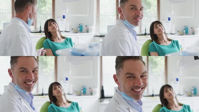 现代牙科诊所微笑的白人男性牙医和女性患者的肖像