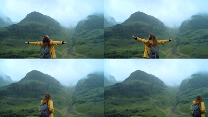 4k视频片段，一个无法识别的女人独自徒步穿越山脉