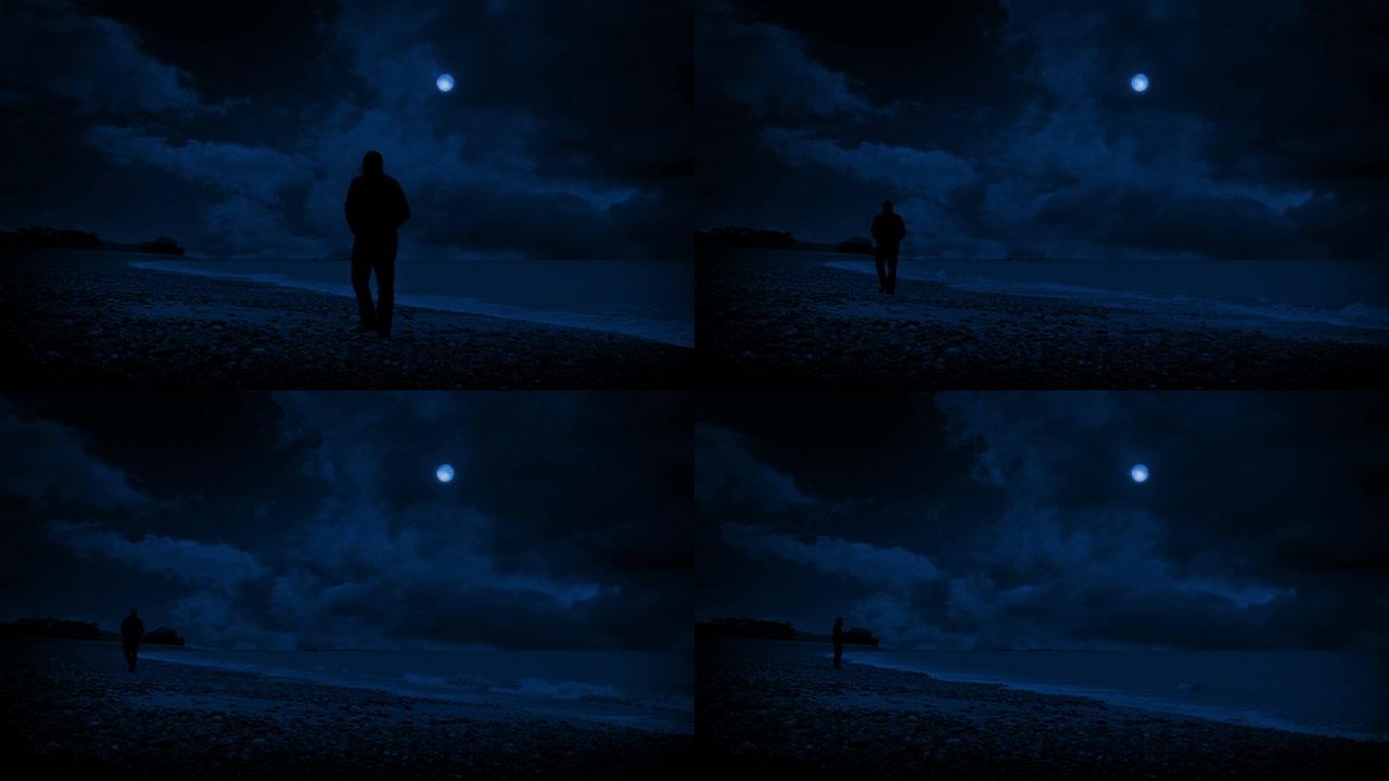 男人沿着海滩散步，晚上望出去