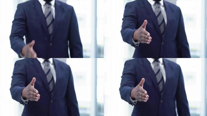 4k视频片段，一个无法辨认的商人站在办公室里示意握手