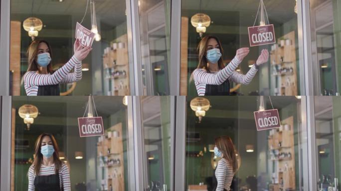 女美发师戴口罩更换标牌在发廊关闭开放