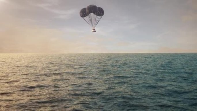 太空舱带着降落伞在海洋上返回地球