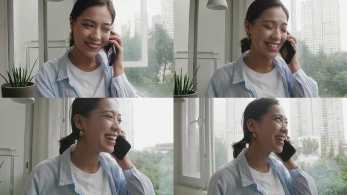 亚洲年轻女子在手机上聊天的特写