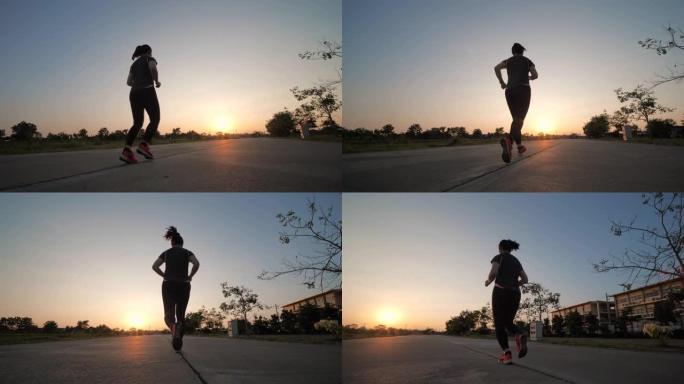 黄昏时分跑步的女性运动的慢动作