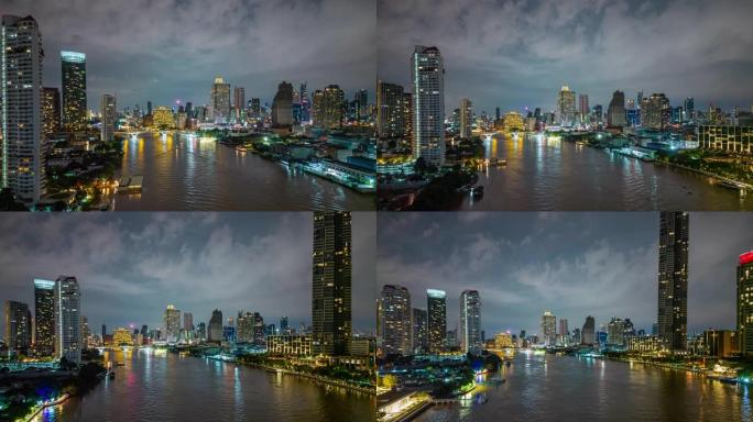 鸟瞰图夜间在市区的Chao Praya河上的曼谷城市景观和摩天大楼