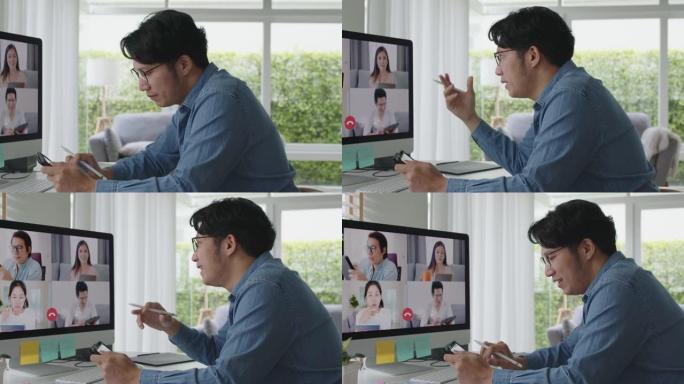 亚洲男子在视频通话中使用计算机和平板电脑在线会议
