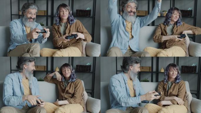 丈夫和妻子使用操纵杆玩视频游戏，然后做高五手势