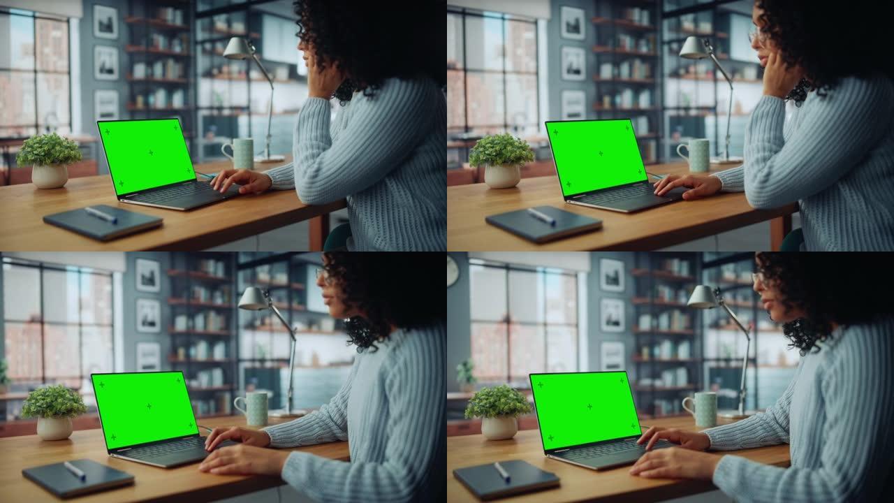 关闭女性专家，在坐在桌子旁的情况下，在家里的客厅使用绿屏模拟显示的笔记本电脑。自由职业者女性在社交网
